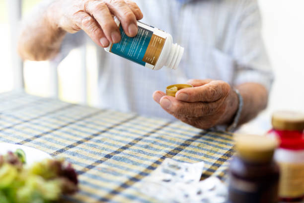 istock Elderly man is getting vitamin pill 1497203608