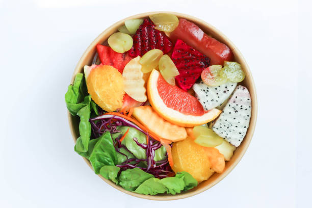 istock fruit and vegetable salad or orange, dragon fruit and lettuce salad 1497204365