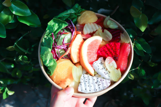istock fruit and vegetable salad or orange, dragon fruit and lettuce salad 1497204368