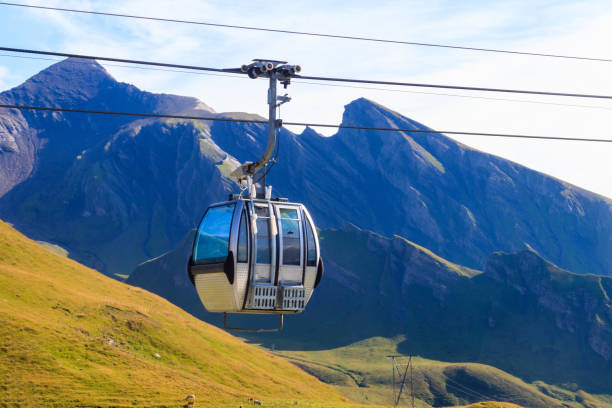 Overhead cable car to First mountain, Grindelwald, Switzerland Overhead cable car to First mountain, Grindelwald, Switzerland Grindlewald stock pictures, royalty-free photos & images