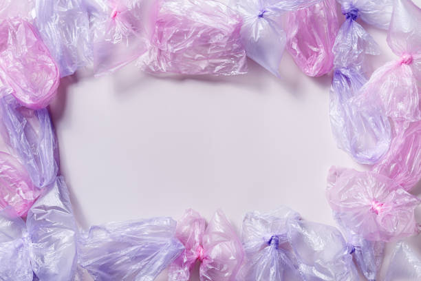 istock Plastic free environment protection concept. Empty used plastic bags,  frame background, copy space. Aesthetic top view colored disposable transparent polyethylene packet. Plastic bag free day 1497206186