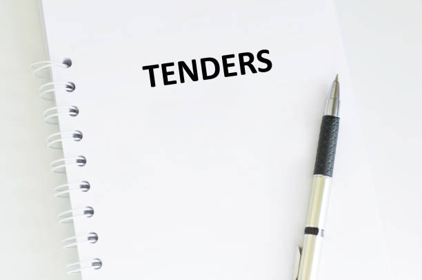 istock FOR TENDER text on a paper on white background 1497206305
