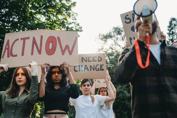 istock A group of climate activists are marching together holding signs 1497210903