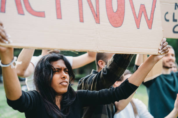 istock A group of climate activists are marching together in a demonstration against climate change 1497210923