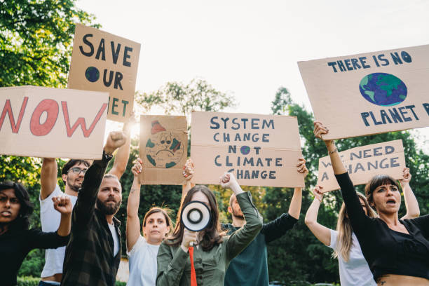 istock A group of climate activists are marching together in a demonstration against climate change 1497210933