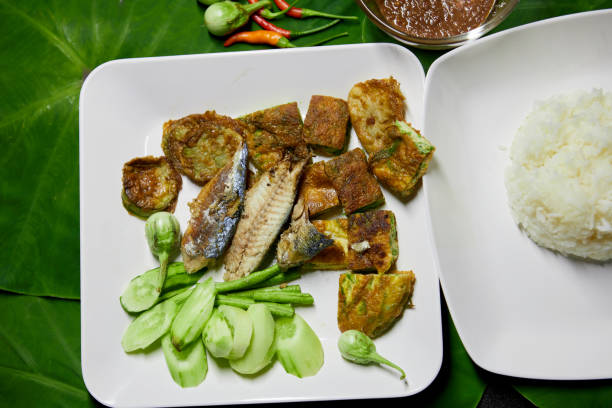 istock Fried mackerel fish with spicy shrimp paste and vegetable  on white plate 1497213938