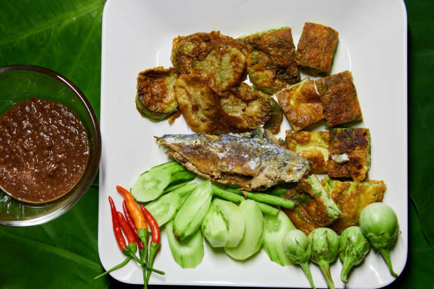 istock Fried mackerel fish with spicy shrimp paste and vegetable  on white plate 1497213946
