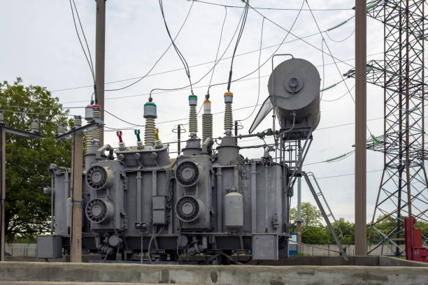 istock Substation with transformers, insulators and switches distributing high voltage. 1497223491
