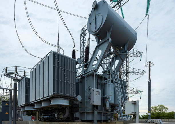 istock Substation with transformers, insulators and switches distributing high voltage. 1497223607