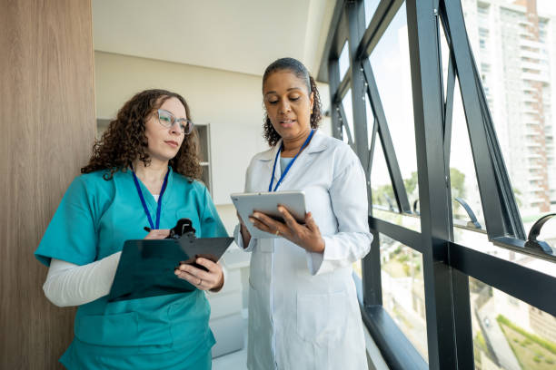 istock Doctor and nurse talking in hospital 1497225610