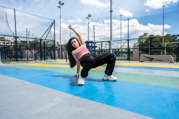 istock Young woman breakdancing outdoors 1497235086