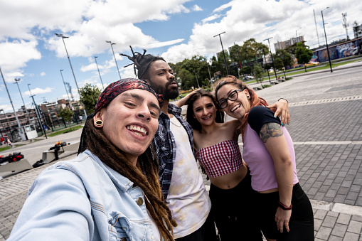 Friends taking a selfie outdoors - Camera point of view