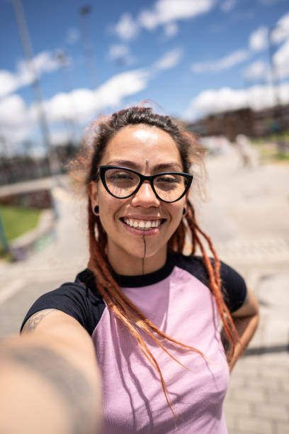 istock Young woman taking a selfie outdoors 1497235590