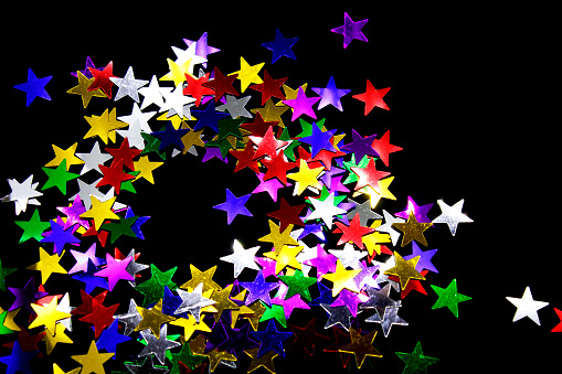 Stars of different colors on a black background