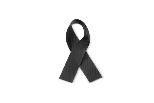 Photo of black awareness ribbon isolated on a white background. Contains clipping path around the ribbon.