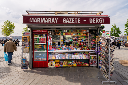 Istanbul, Turkey - May 3, 2023: Traditional Street kiosk selling newspapers, magazines, snacks and drinks, located in Eminonu square