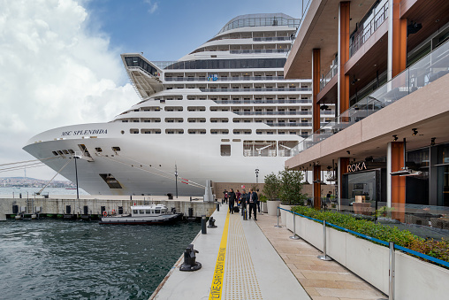 Istanbul, Turkey - May 5, 2023: MSC SPLENDIDA, Large cruise ship docked at terminal of Galataport, a mixed use development located along shore of Bosphorus strait, in Karakoy neighbourhood