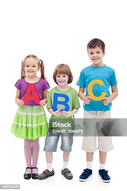 Happy School Kids Holding Large Abc Letters Stock Photo - Download Image Now - Alphabet, Back to School, Beautiful People