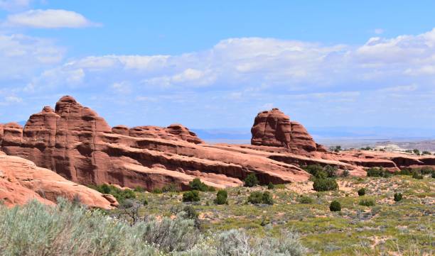 istock Arches National Park Utah Red Rocks Blue Sky with Puffy Clouds Devils Garden 1497245115
