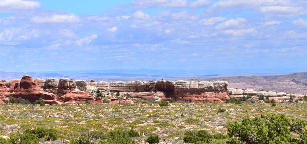 istock Arches National Park Utah Red Rocks Blue Sky with Puffy Clouds Devils Garden 1497245124