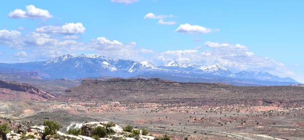 istock Arches National Park Utah Red Rocks Blue Sky Devil's Garden Snow Capped Mountains 1497245662