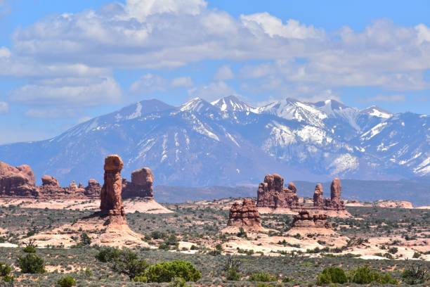 istock Arches National Park Utah Red Rocks Blue Sky Devil's Garden Snow Capped Mountains 1497245663