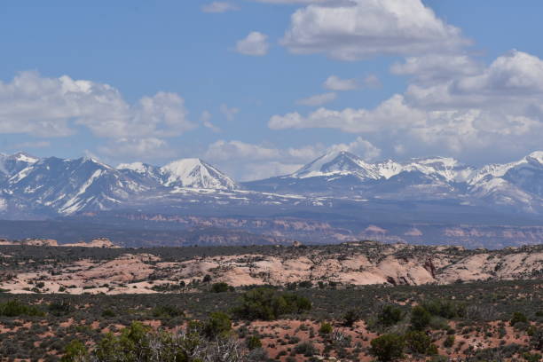 istock Arches National Park Utah Red Rocks Blue Sky Devil's Garden Snow Capped Mountains 1497245715