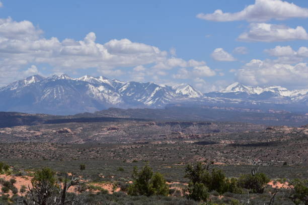 istock Arches National Park Utah Red Rocks Blue Sky Devil's Garden Snow Capped Mountains 1497245716