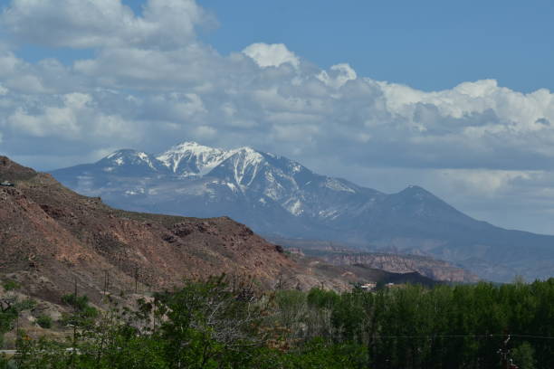 istock Arches National Park Utah Red Rocks Blue Sky Devil's Garden Snow Capped Mountains 1497245722