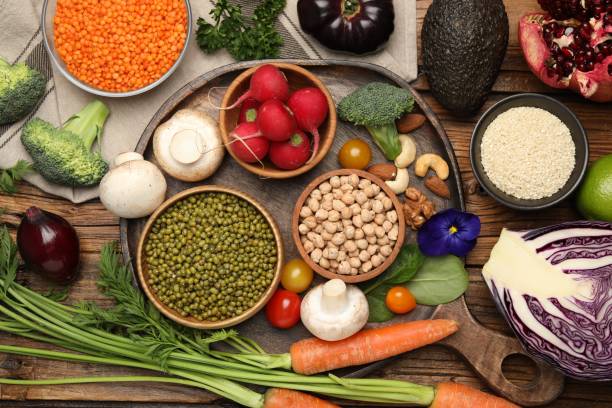 istock Different vegetables on wooden table, flat lay. Vegan diet 1497249653