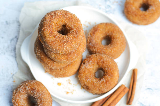 istock Cinnamon Donuts, Freshly Baked Doughnuts Covered in Sugar and Cinnamon Mixture 1497251102