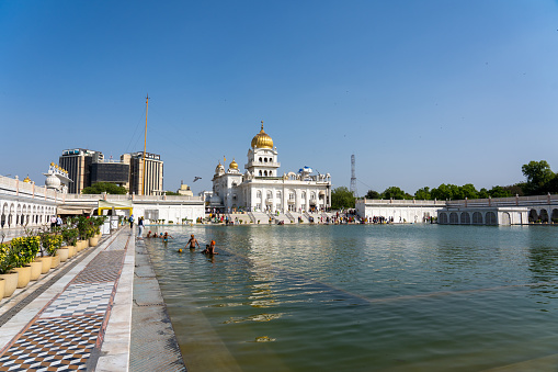 New Delhi, India - April 11, 2023: Exterior view of Gurudwara Bangla Sahib, a famous Sikh house of worship.