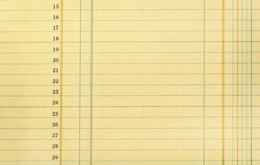 Closeup of yellow numbered ledger paper