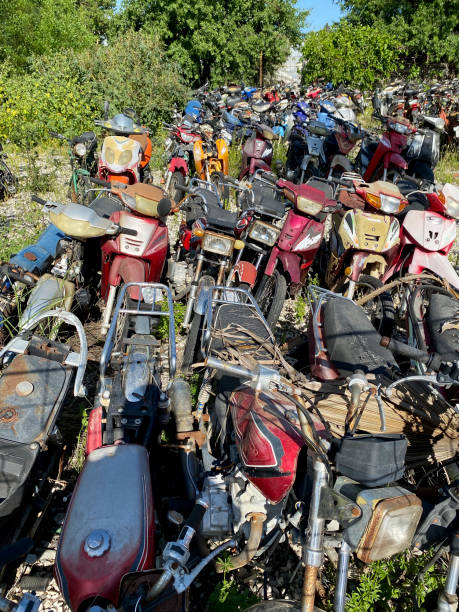 istock Old scooter motorcycles in the junkyard 1497253902