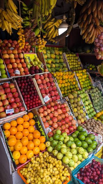 istock Vibrant selection of fresh fruit on display at a market stand 1497253974