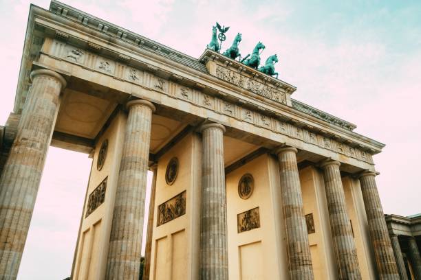 istock Architectural structure featuring statues atop its grand height, standing tall in a landscape 1497257948