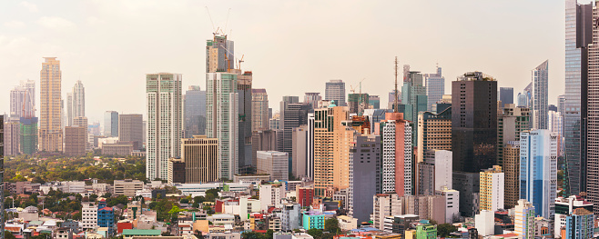 View towards Makati in Metro Manila, with many office and apartment buildings.