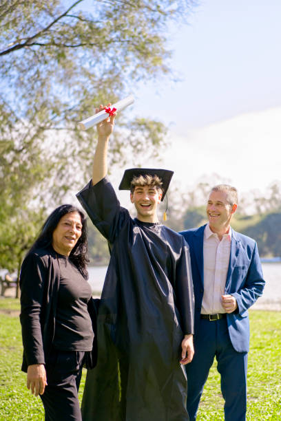 Excited Latin American graduate student celebrating his achievement at his graduation ceremony