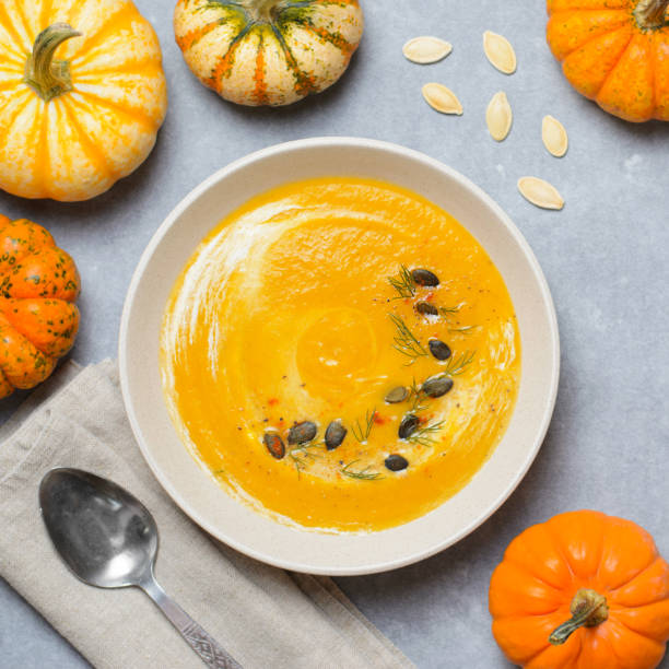 istock Pumpkin Soup with Cream, Dill and Pumpkin Seeds, Top View 1497260196