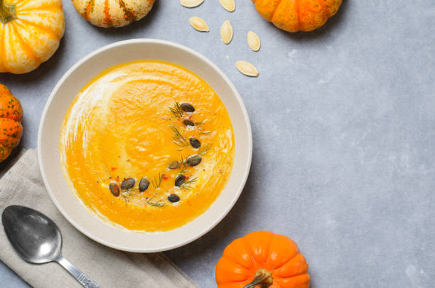 istock Pumpkin Soup with Cream, Dill and Pumpkin Seeds, Top View 1497261289