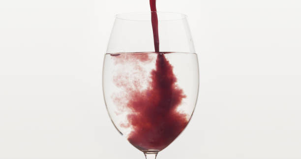 istock pour blueberry juice into water in wine glass 1497264598