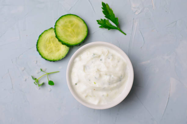 istock Tzatziki, Yoghurt Sauce with Cucumber on Bright Background 1497265555
