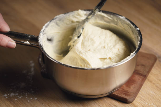 istock female hands mixing sticky dough 1497267289