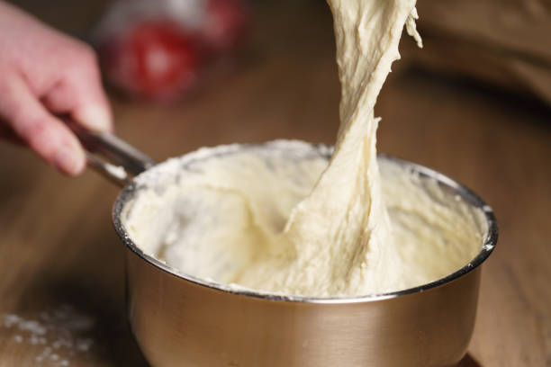istock female hands mixing sticky dough 1497267433