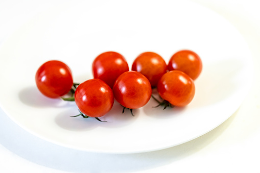 Australian Cherry Tomatoes, white background with copy space, full frame horizontal composition