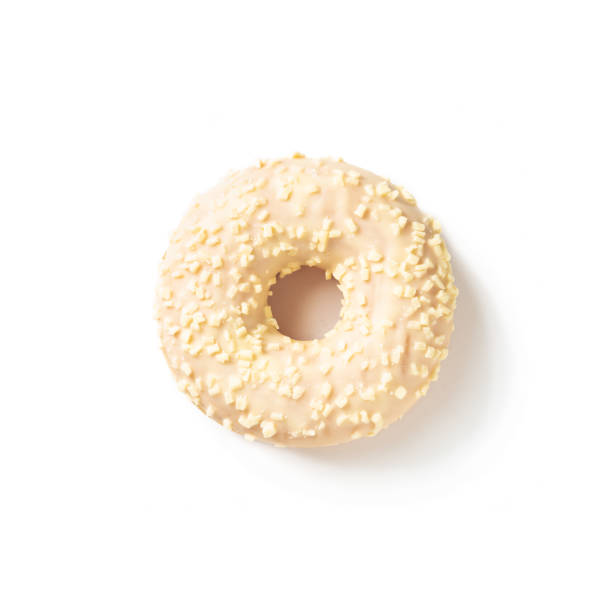 Sweet donut in white icing on a white background top view