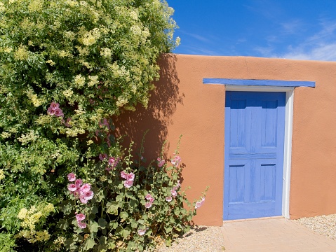 Blue and terra cotta contrasts in this Mesilla doorway in old town. Vibrant colors stand up to the harsh light in the desert southwest.