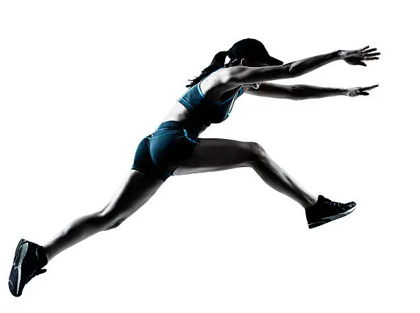 one caucasian woman runner jogger jumping in silhouette studio on white background