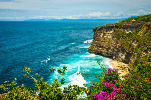 Beautiful Uluwatu coast with rocks and ocean waves, Bali, Indonesia