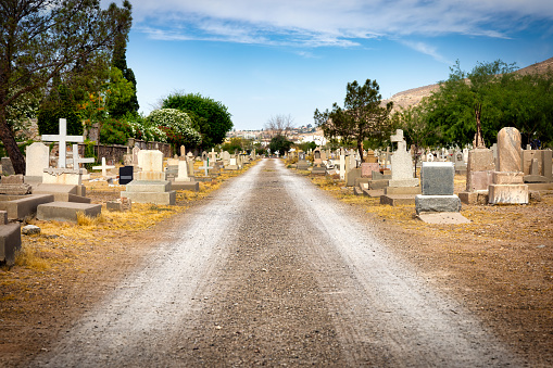 The gravel road that passes through Concordia Cemetery in El Paso, Texas.